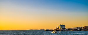 Preview wallpaper sea, houses, sky, sunset