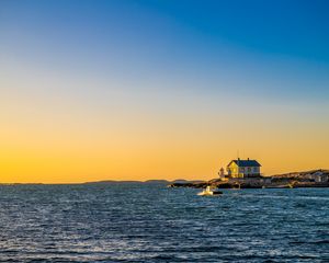 Preview wallpaper sea, houses, sky, sunset