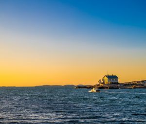 Preview wallpaper sea, houses, sky, sunset