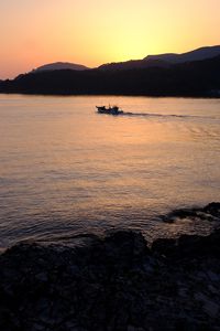 Preview wallpaper sea, island, bay, boat, twilight, silhouettes