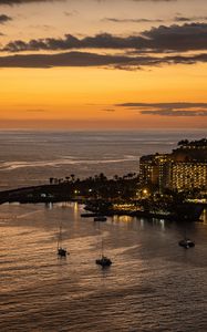 Preview wallpaper sea, island, boats, shore, lights, evening