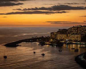 Preview wallpaper sea, island, boats, shore, lights, evening