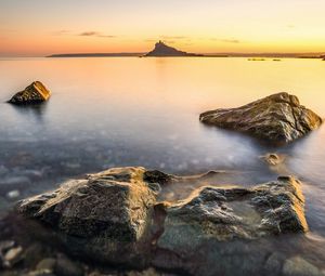 Preview wallpaper sea, island, silhouette, stones, nature