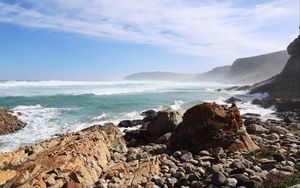 Preview wallpaper sea, landscape, stones, pebbles, mountains