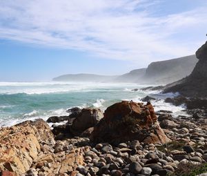Preview wallpaper sea, landscape, stones, pebbles, mountains