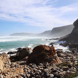 Preview wallpaper sea, landscape, stones, pebbles, mountains