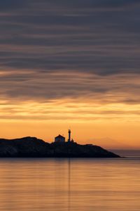 Preview wallpaper sea, lighthouse, sunset