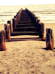 Preview wallpaper sea, mooring, columns, sand, beach