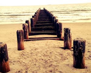 Preview wallpaper sea, mooring, columns, sand, beach