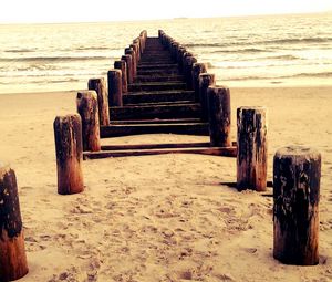 Preview wallpaper sea, mooring, columns, sand, beach