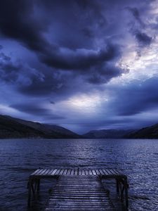 Preview wallpaper sea, mountains, evening, clouds, overcast, pier, scotland