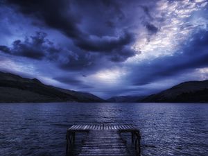 Preview wallpaper sea, mountains, evening, clouds, overcast, pier, scotland