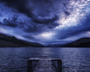 Preview wallpaper sea, mountains, evening, clouds, overcast, pier, scotland