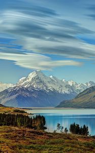 Preview wallpaper sea, mountains, sky, beautiful, grass