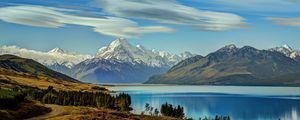 Preview wallpaper sea, mountains, sky, beautiful, grass