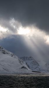 Preview wallpaper sea, mountains, snow, sunlight, clouds