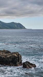 Preview wallpaper sea, mountains, stones, rocks, nature, clouds