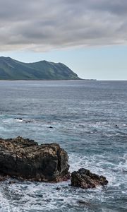 Preview wallpaper sea, mountains, stones, rocks, nature, clouds
