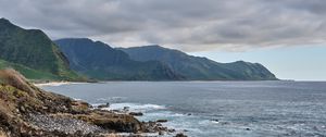 Preview wallpaper sea, mountains, stones, rocks, nature, clouds