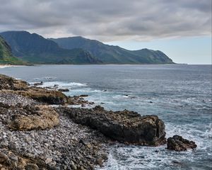 Preview wallpaper sea, mountains, stones, rocks, nature, clouds