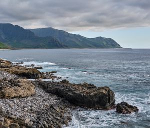 Preview wallpaper sea, mountains, stones, rocks, nature, clouds