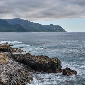 Preview wallpaper sea, mountains, stones, rocks, nature, clouds