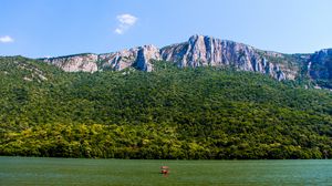 Preview wallpaper sea, mountains, trees, hill, landscape