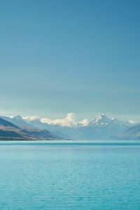 Preview wallpaper sea, mountains, water, sky, horizon, clouds