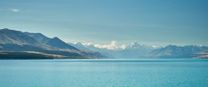 Preview wallpaper sea, mountains, water, sky, horizon, clouds