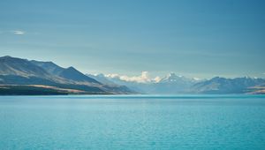 Preview wallpaper sea, mountains, water, sky, horizon, clouds