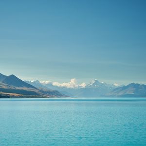 Preview wallpaper sea, mountains, water, sky, horizon, clouds