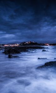 Preview wallpaper sea, night, moon, clouds, rocks, shore, lights