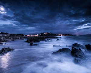 Preview wallpaper sea, night, moon, clouds, rocks, shore, lights