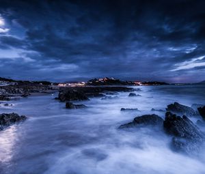 Preview wallpaper sea, night, moon, clouds, rocks, shore, lights