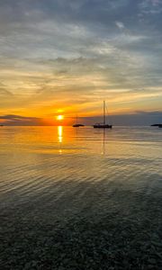 Preview wallpaper sea, pebbles, bottom, boats, sunset