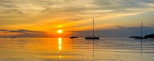 Preview wallpaper sea, pebbles, bottom, boats, sunset