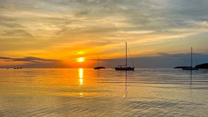 Preview wallpaper sea, pebbles, bottom, boats, sunset