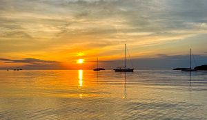 Preview wallpaper sea, pebbles, bottom, boats, sunset