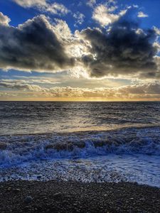 Preview wallpaper sea, pebbles, coast, horizon, sky