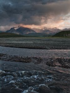 Preview wallpaper sea, pebbles, coast, hills, mountains, nature