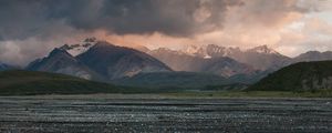 Preview wallpaper sea, pebbles, coast, hills, mountains, nature