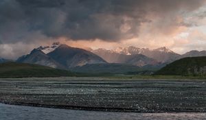 Preview wallpaper sea, pebbles, coast, hills, mountains, nature