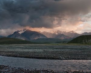 Preview wallpaper sea, pebbles, coast, hills, mountains, nature