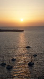 Preview wallpaper sea, pier, horizon, boats, sunset