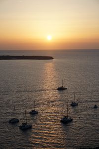 Preview wallpaper sea, pier, horizon, boats, sunset