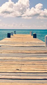 Preview wallpaper sea, pier, sky, clouds