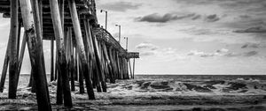 Preview wallpaper sea, pilings, pier, waves, black and white