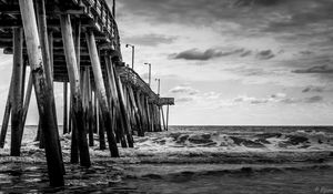 Preview wallpaper sea, pilings, pier, waves, black and white