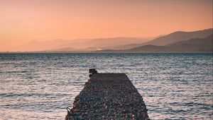 Preview wallpaper sea, plate, breakwater, water, coast, hills