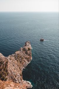 Preview wallpaper sea, rock, aerial view, ship, water